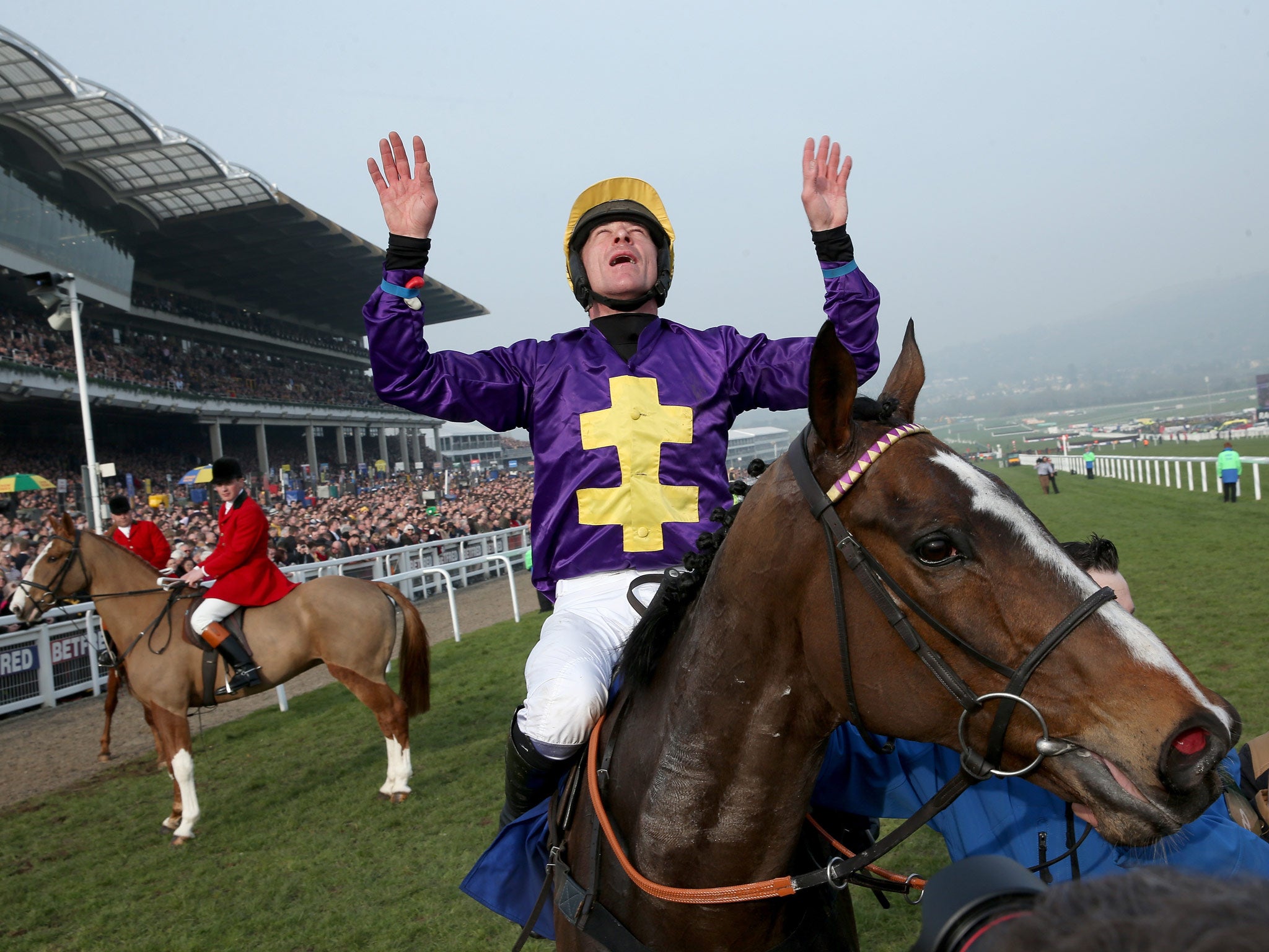 Davy Russell celebrates after riding Lord Windermere to victory in the Betfred Cheltenham Gold Cup Chase on Gold Cup day at the Cheltenham Festival