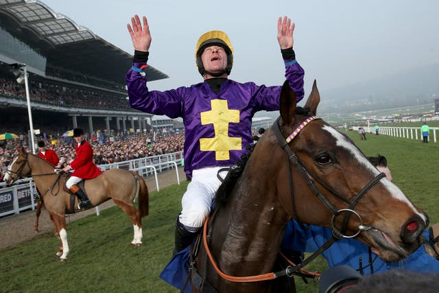  Davy Russell celebrates after riding Lord Windermere to victory in the Betfred Cheltenham Gold Cup Chase on Gold Cup day at the Cheltenham Festival