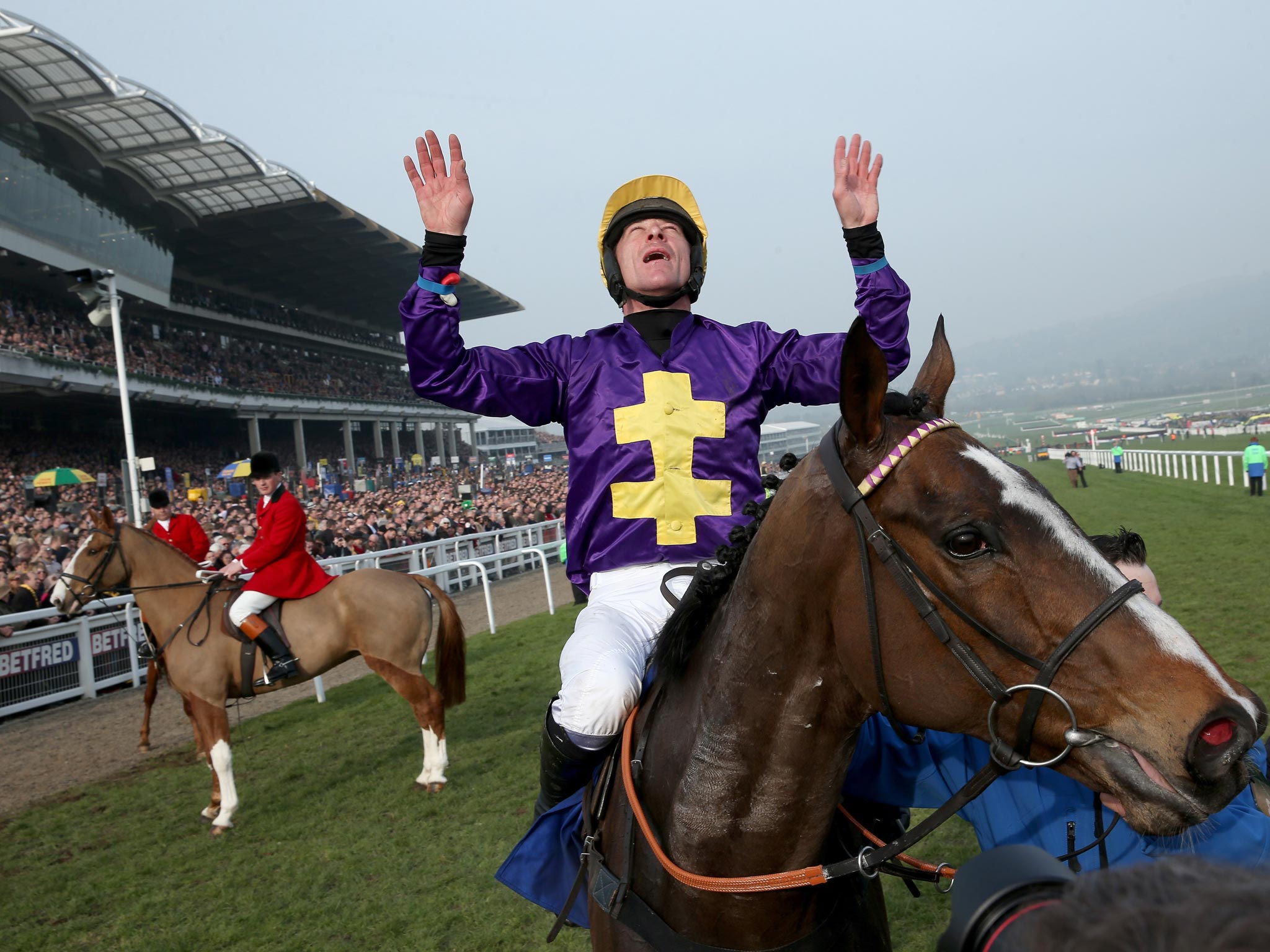 Davy Russell celebrates after riding Lord Windermere to victory in yesterday’s Cheltenham Gold Cup, edging On His Own in a photo finish