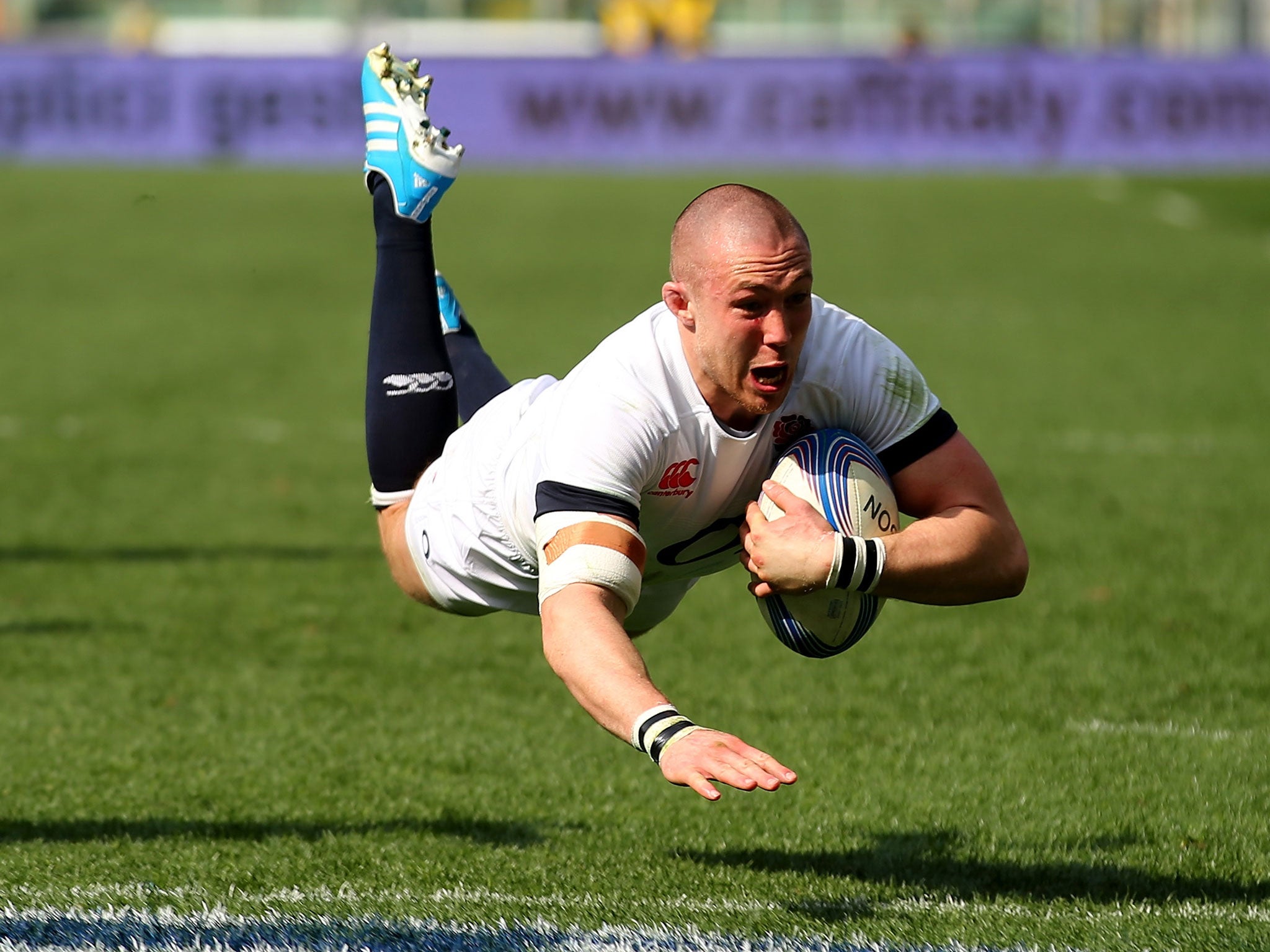 Mike Brown of England celebrates after scoring the second try