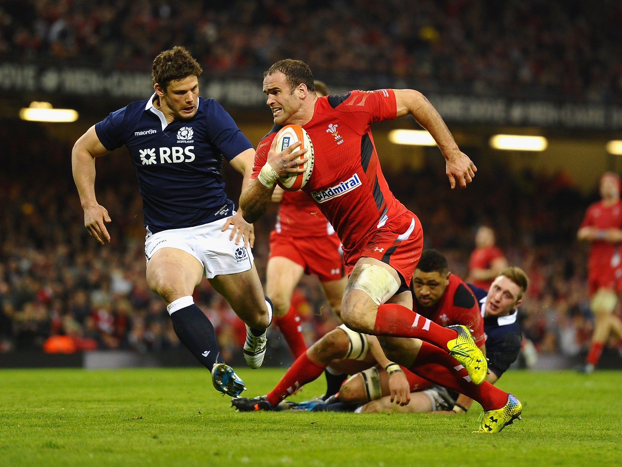 Jamie Roberts of Wales scores a try under pressure