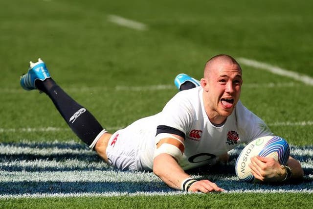 Mike Brown of England celebrates after scoring the first try during the Six Nations match between Italy and England at the Stadio Olimpico