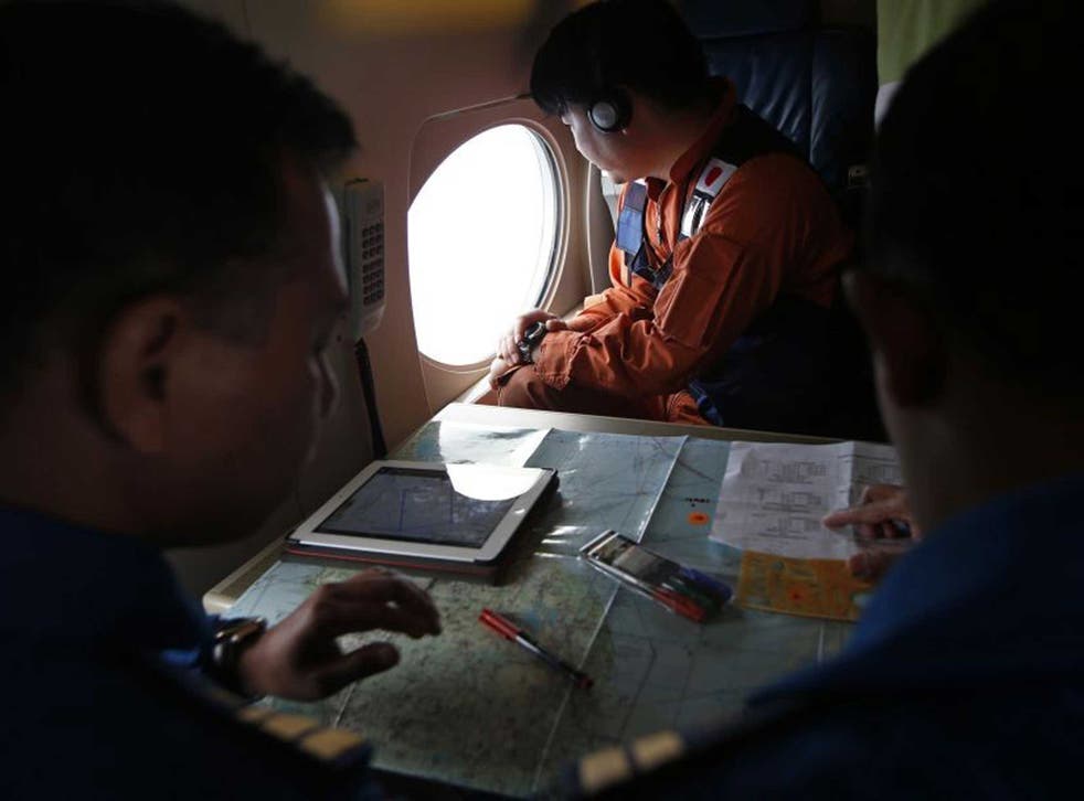 Japanese and Malaysian pilots search for the missing plane 