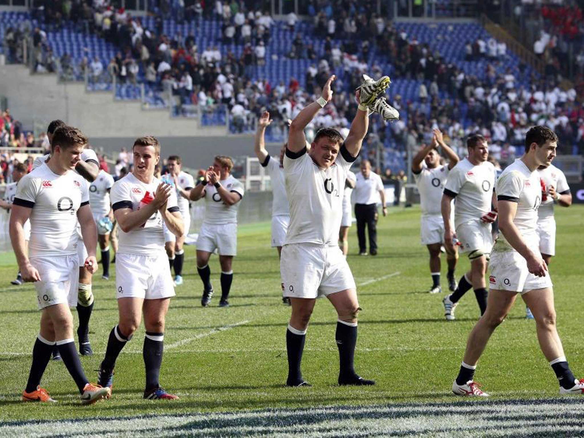 Rosy future: England players applaud the fans in Rome after their win which capped a strong Six Nations