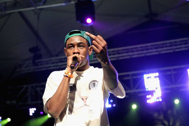 Rapper Tyler The Creator performs with Earl Sweatshirt onstage during day 1 of the 2013 Coachella festival
