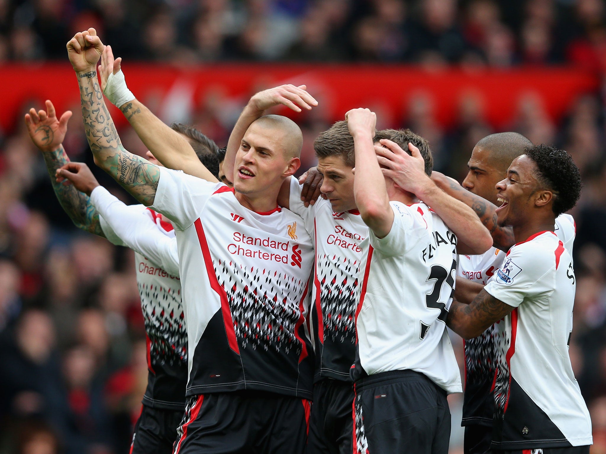 Steven Gerrard is congratulated by his team-mates (GETTY)