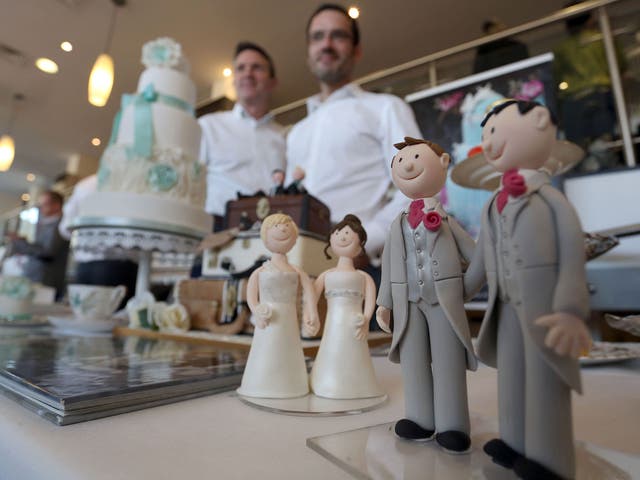 Stalls marketing wedding products at the Gay Wedding Show in London yesterday. Same-sex couples in England and Wales will legally be able to get married on 29 March