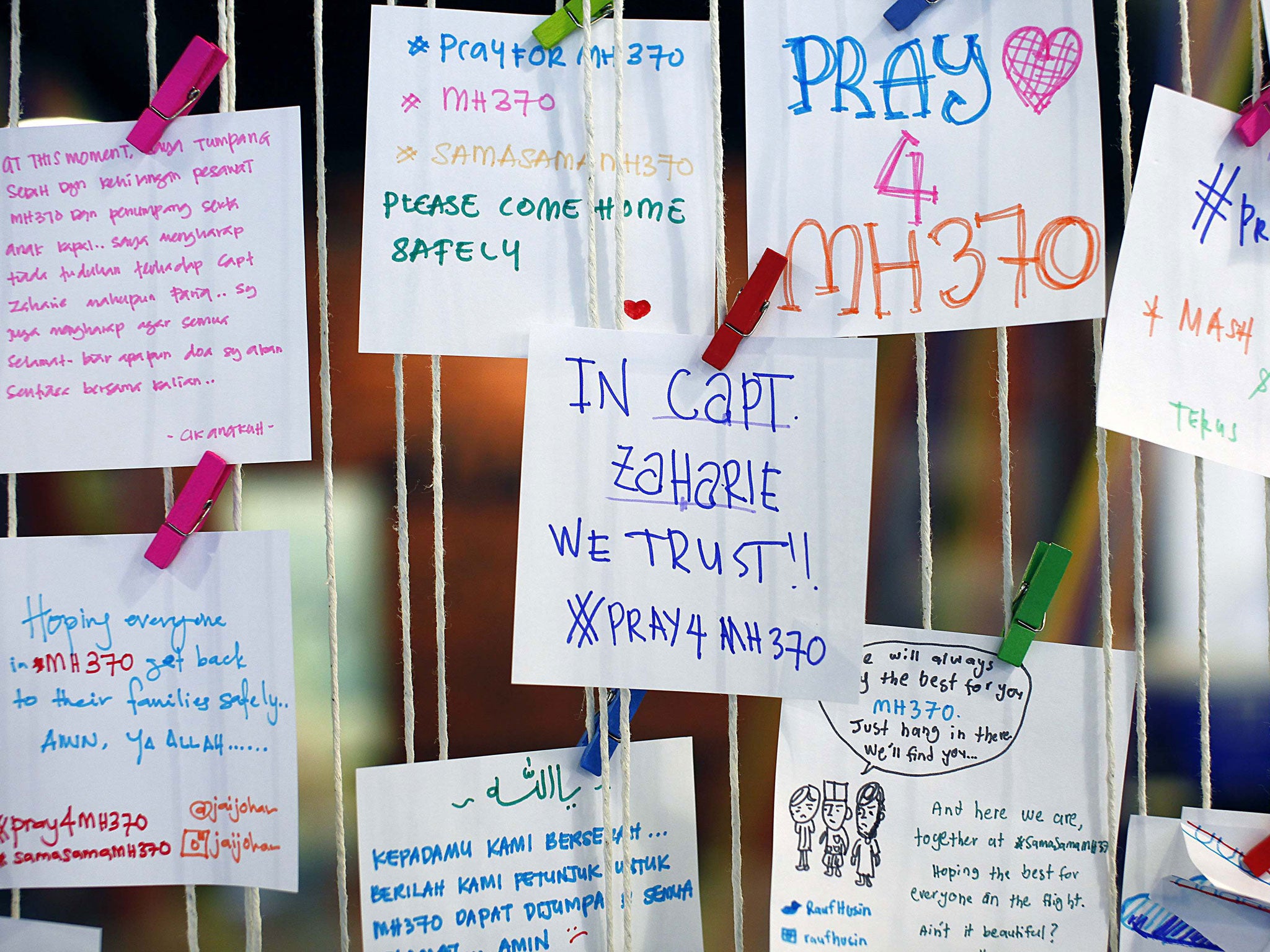 A message for pilot Zaharie Ahmad Shah, captain of the missing Malaysia Airlines Flight MH370, is pictured at an event to express solidarity to the family members of passengers onboard the plane