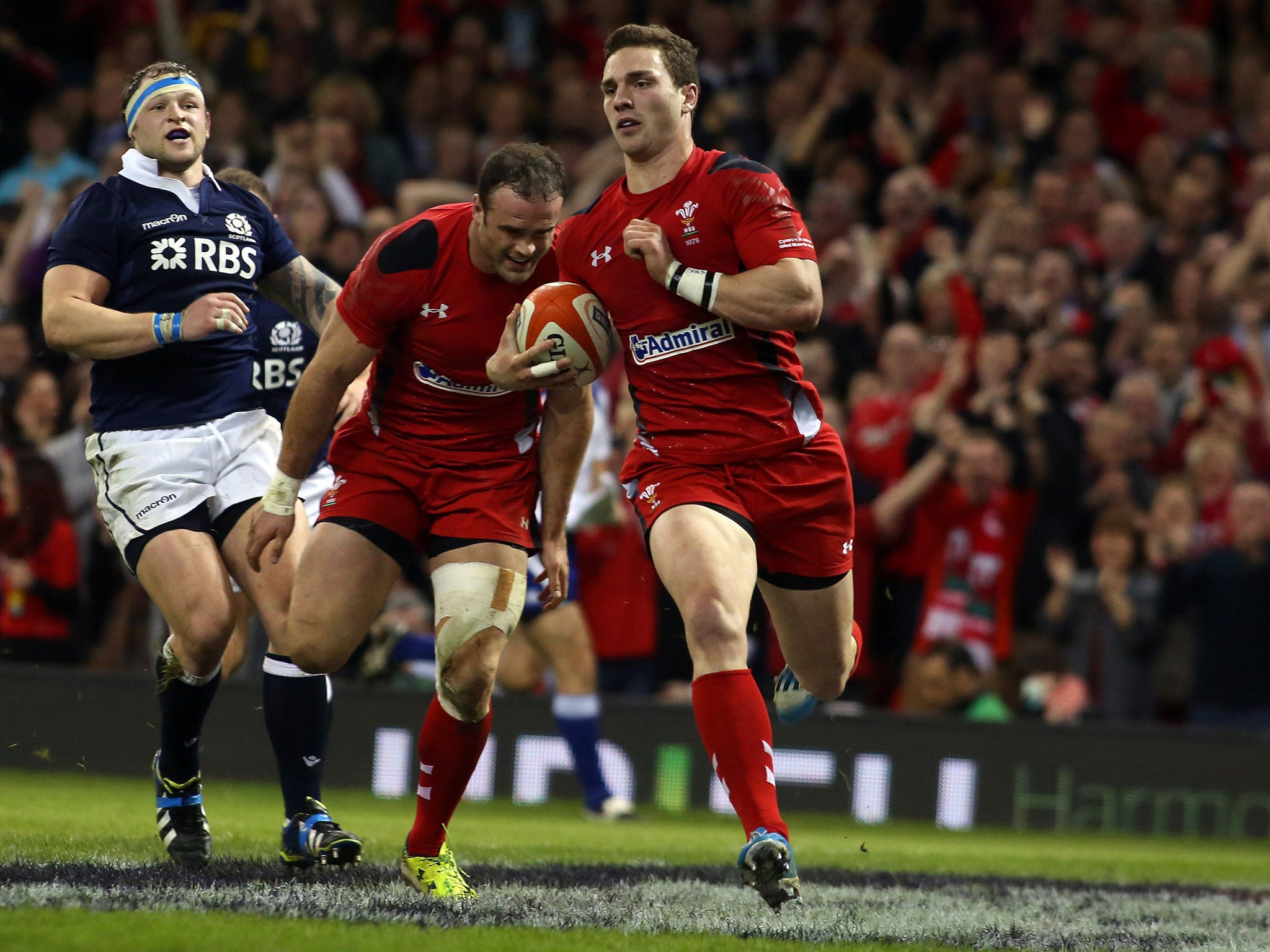 George North runs in a try during Wales’ win over Scotland