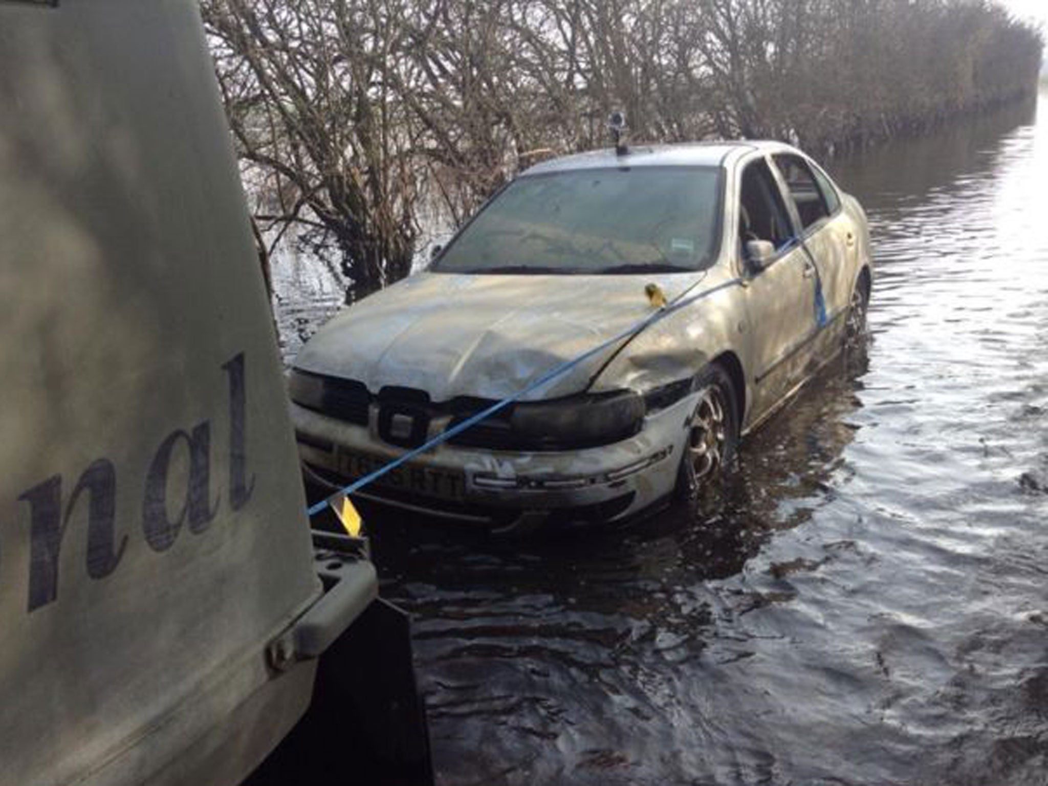 The submerged Seat Toledo, pictured here as it was finally towed away last week, featured in national and international media coverage of the floods