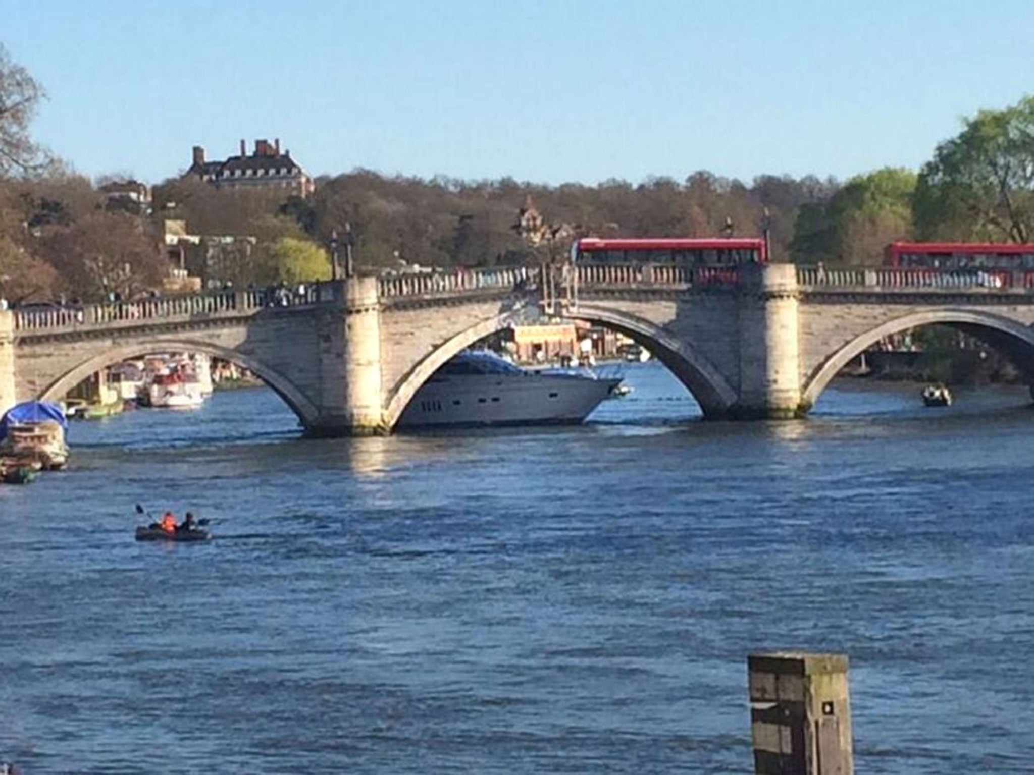 A yacht which got stuck on the River Thames under Richmond bridge in London.