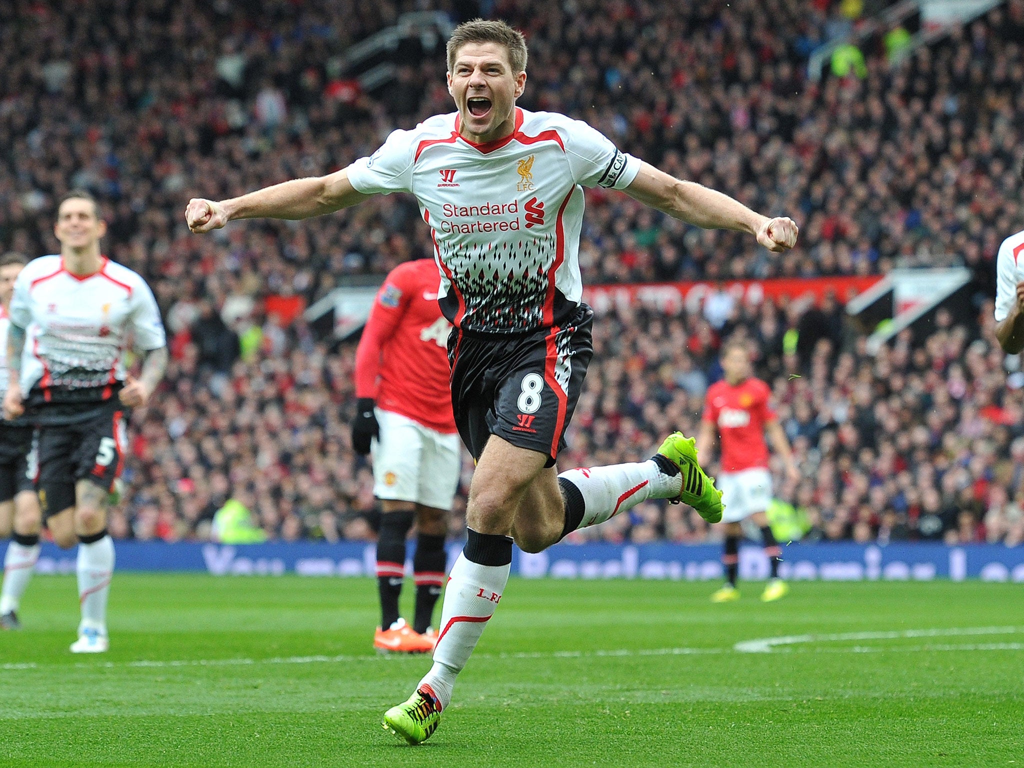 Steven Gerrard celebrates scoring his second penalty in the 3-0 win over Manchester United