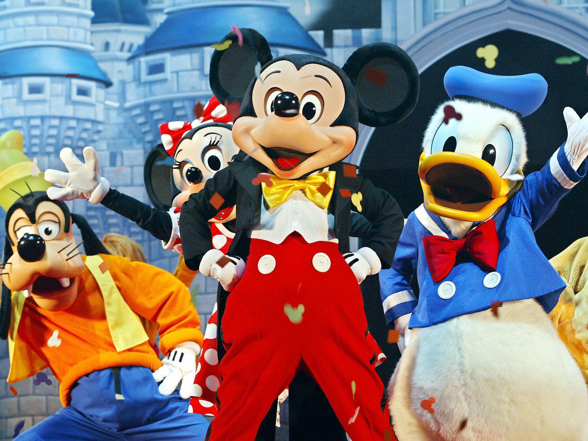 Mickey Mouse (C) and other Walt Disney characters perform at Disneyland, where a mother took a trip using money she allegedly raised by pretending her son had cancer.