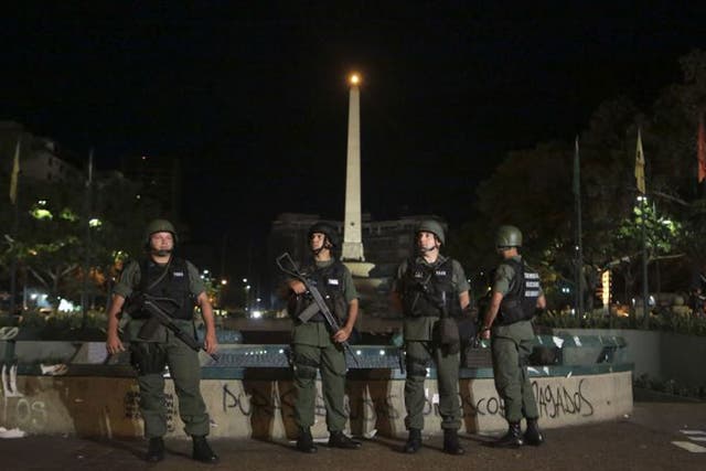 National Guardsmen stand guard at Plaza Altamira in Caracas
