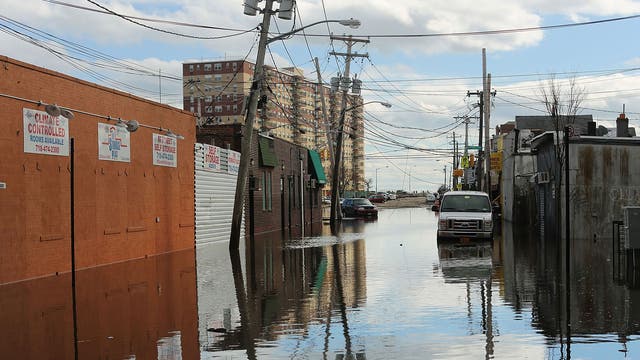 Flood damaged streets in Queens, New York where the historic boardwalk was washed away due to Hurricane Sandy in 2012. The report predicts that by the end of the century “hundreds of millions of people will be affected by coastal flooding and displaced due to land loss”