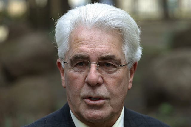 Publicist Max Clifford arrives at Southwark Crown Court in central London March 18, 2014