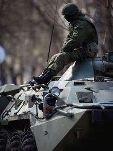 SHOTS FIRED AND ONE OFFICER WOUNDED AS 'RUSSIAN TROOPS' STORM UKRAINIAN MILITARY BASE