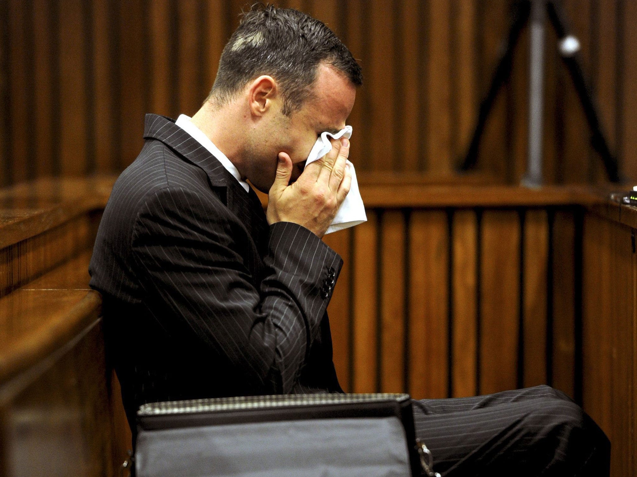 Oscar Pistorius cries during his trial at the North Gauteng High Court, Pretoria