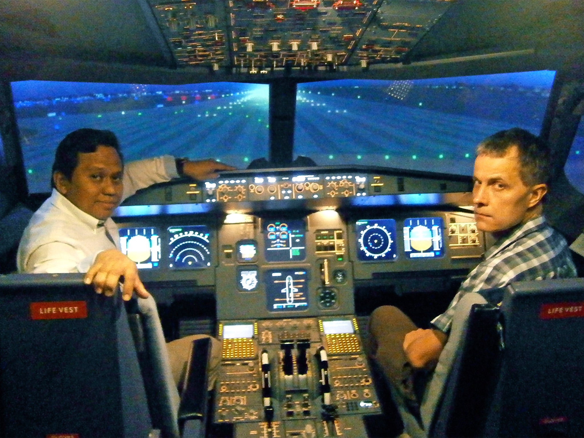 Andrew Buncombe with Capt Amin Said in a flight simulator