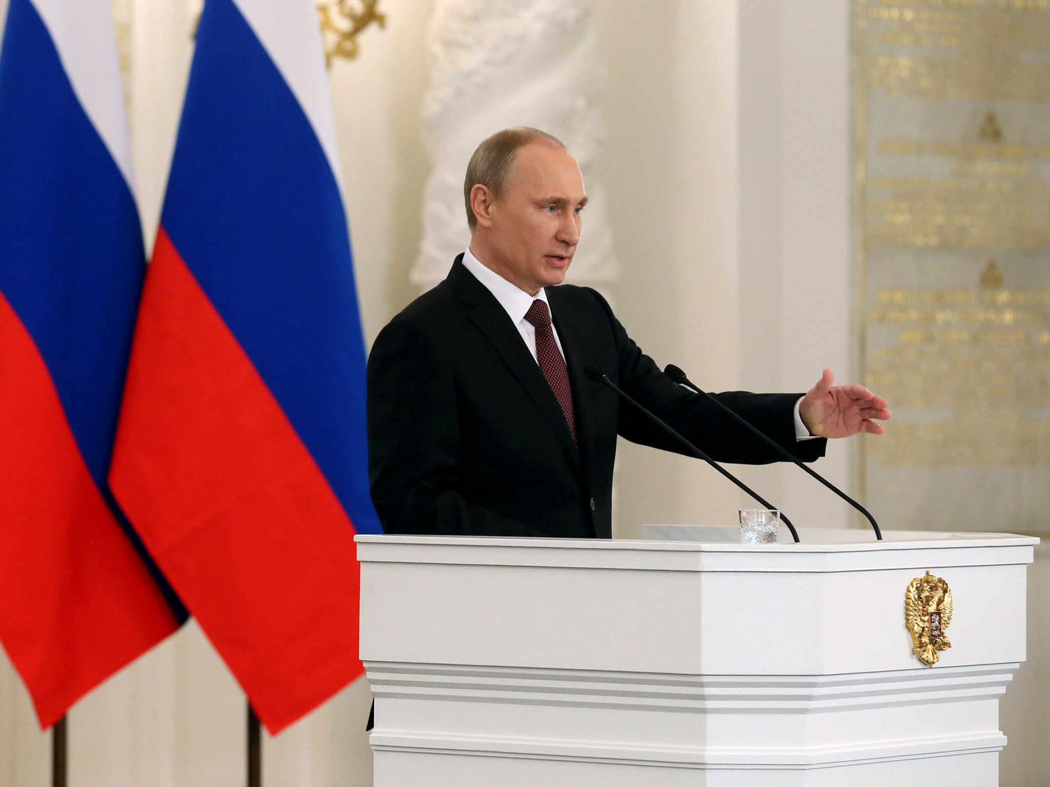 President Vladimir Putin addresses the Federation Council in Moscow's Kremlin