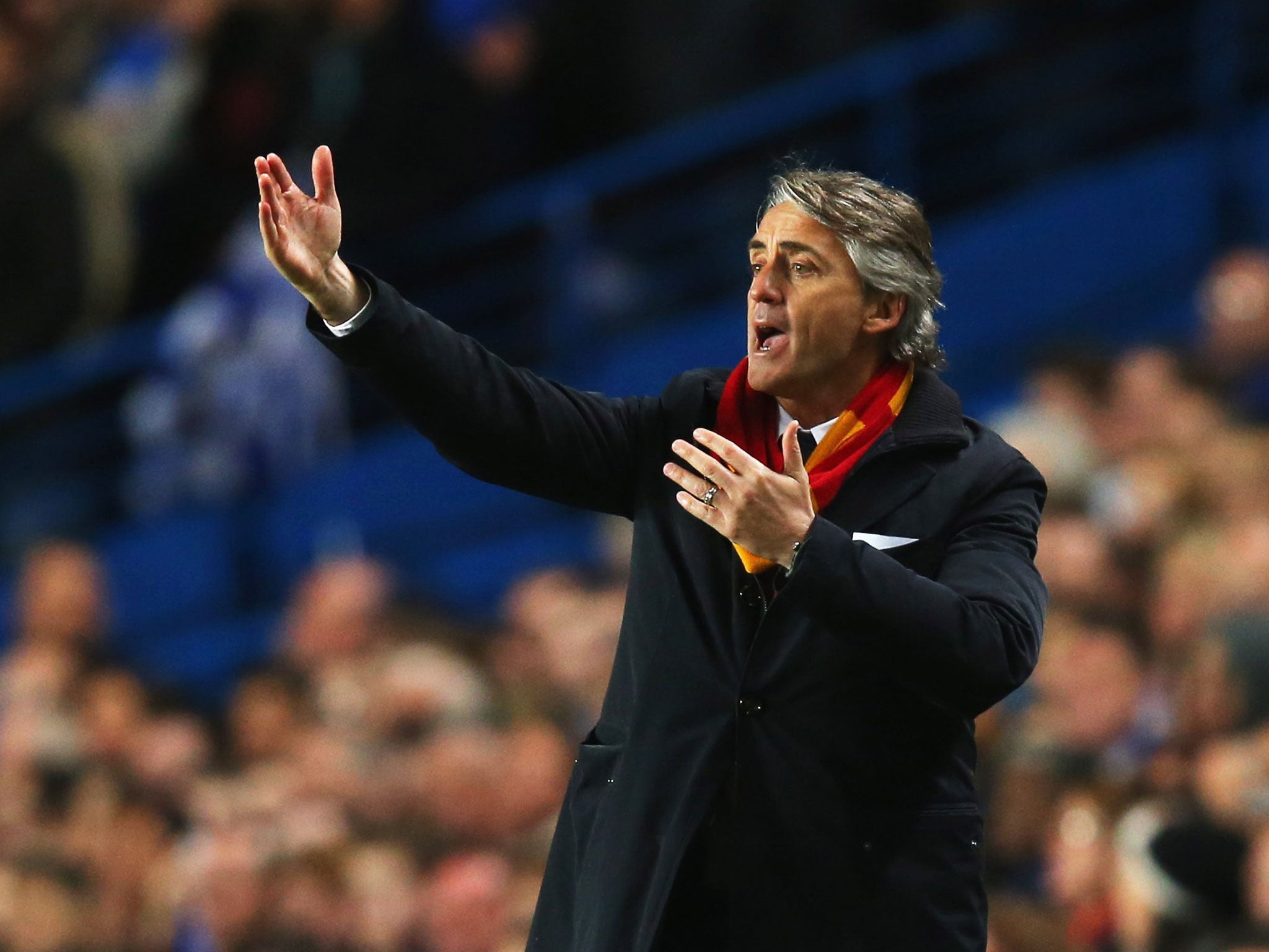 Roberto Mancini makes a gesture from the touchline at Stamford Bridge