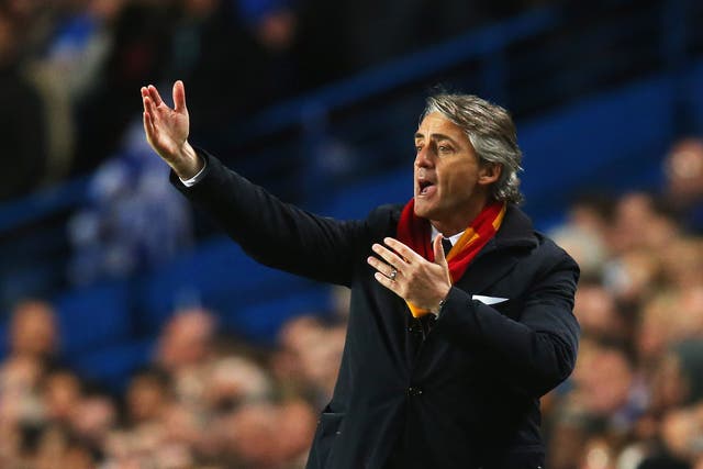 Roberto Mancini makes a gesture from the touchline at Stamford Bridge