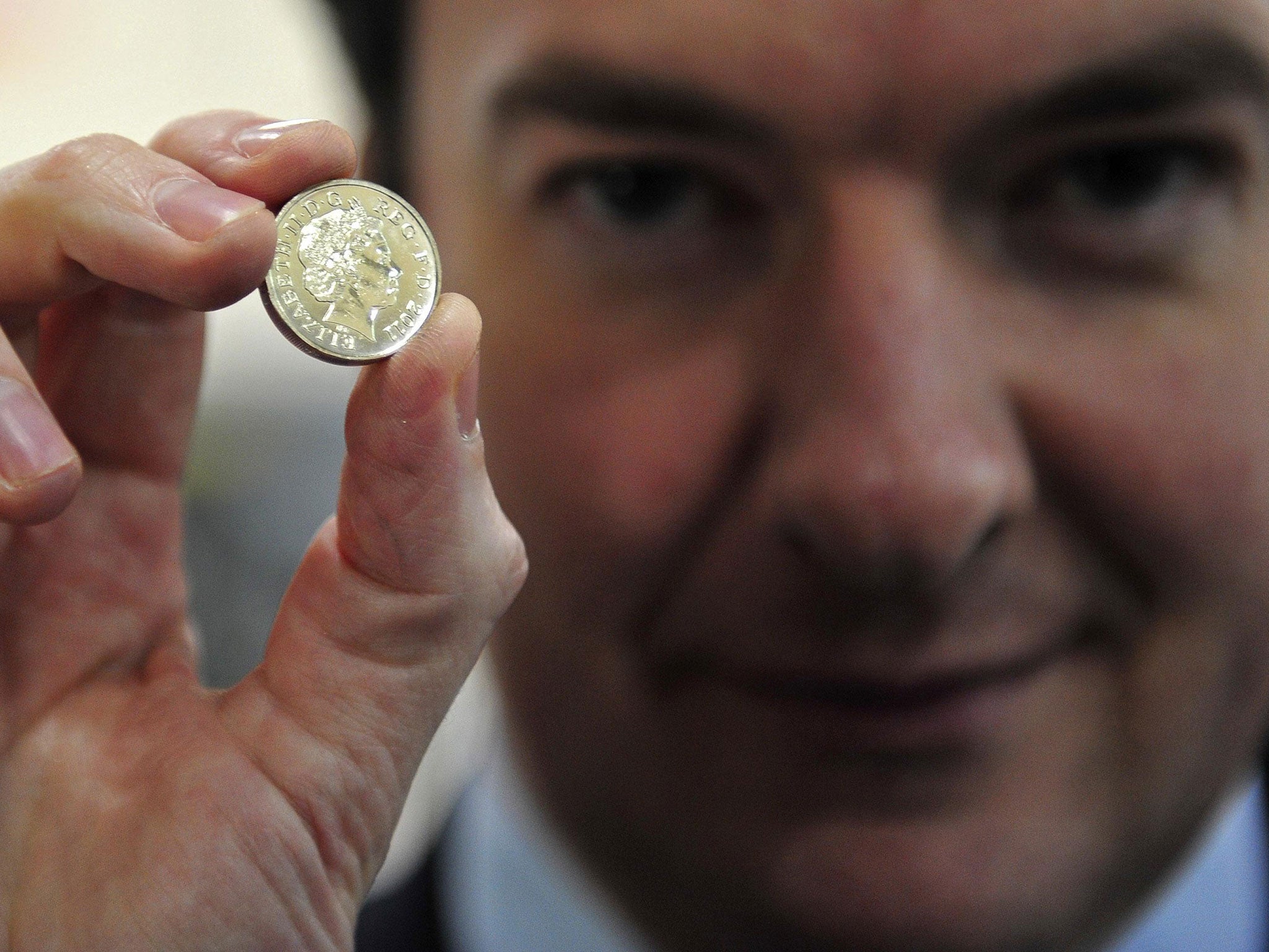 George Osborne with one of the current coins