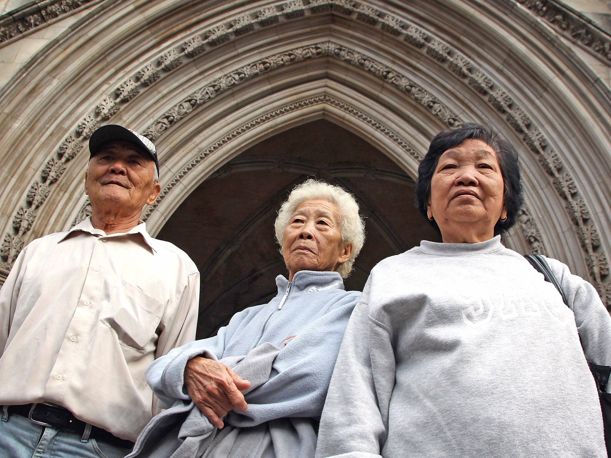 Relatives of those killed in the Batang Kali massacre, outside the High Court in 2012