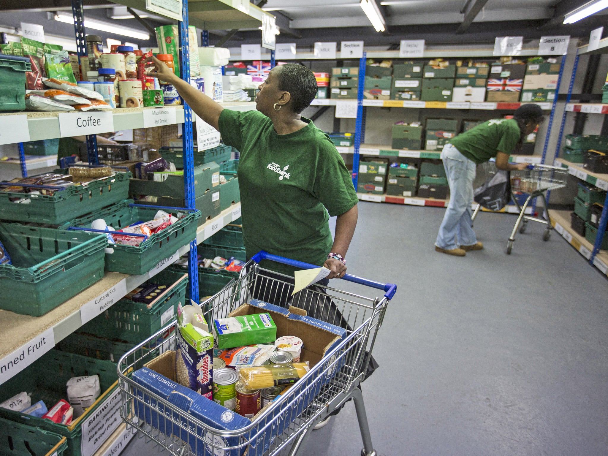 Patricia White, manager of Central Birmingham Food Bank, collects supplies for a customer