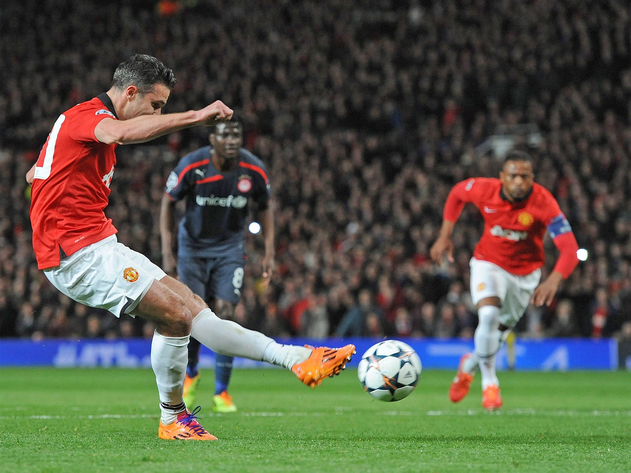Robin van Persie converts a penalty to give United the lead on the night