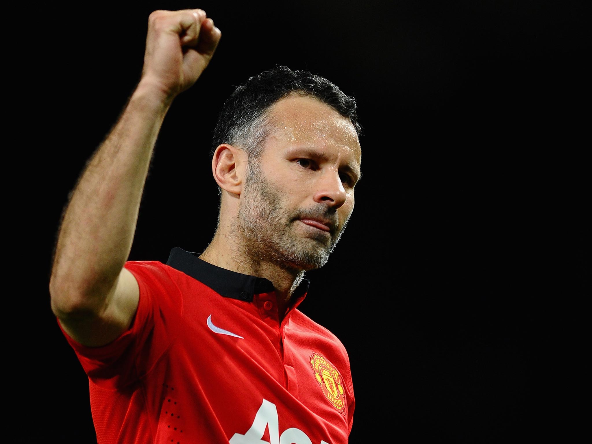 Ryan Giggs celebrates after Manchester United's 3-0 victory over Olympiakos
