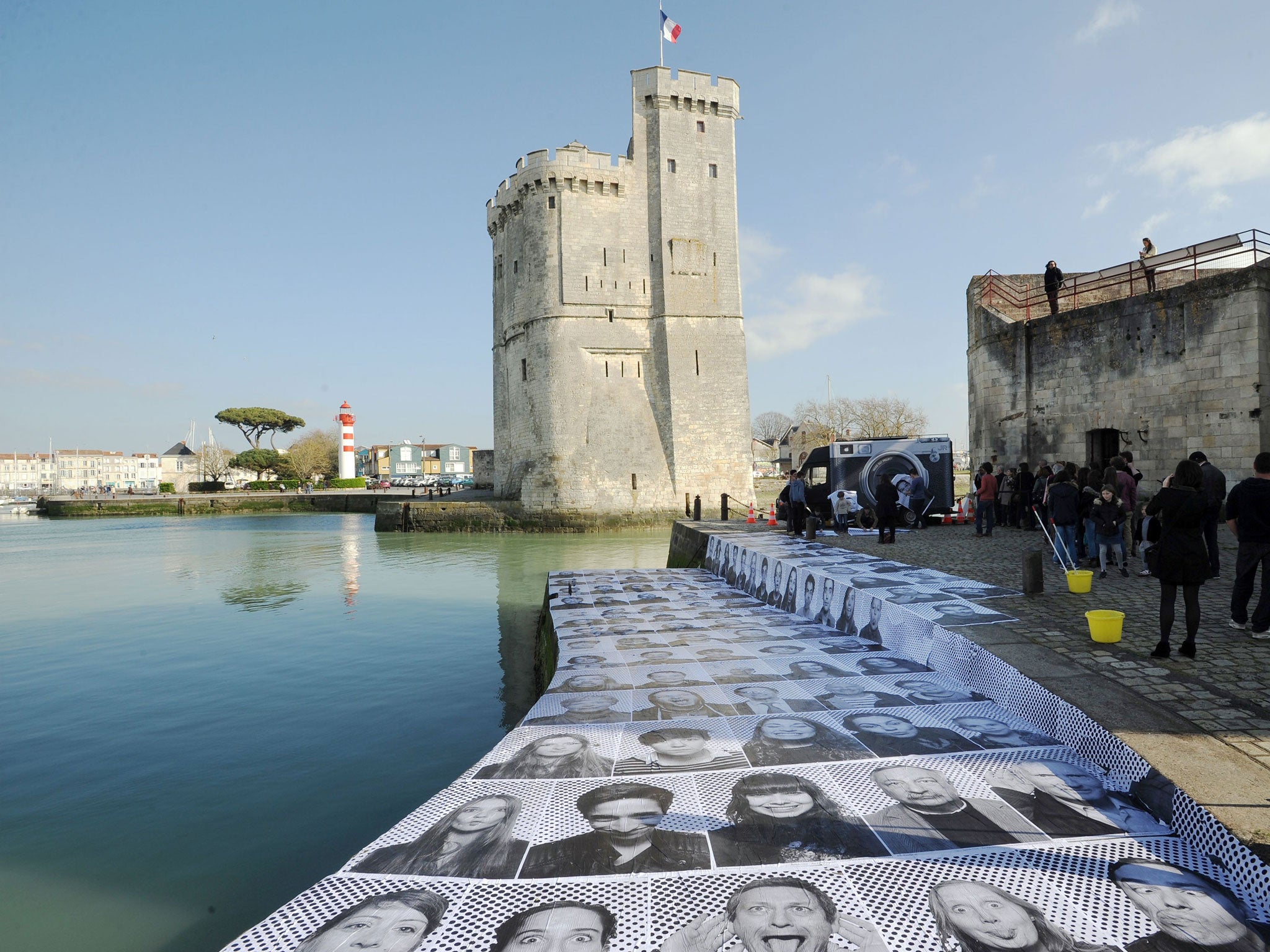 The portraits are also displayed on a harbour's embankment