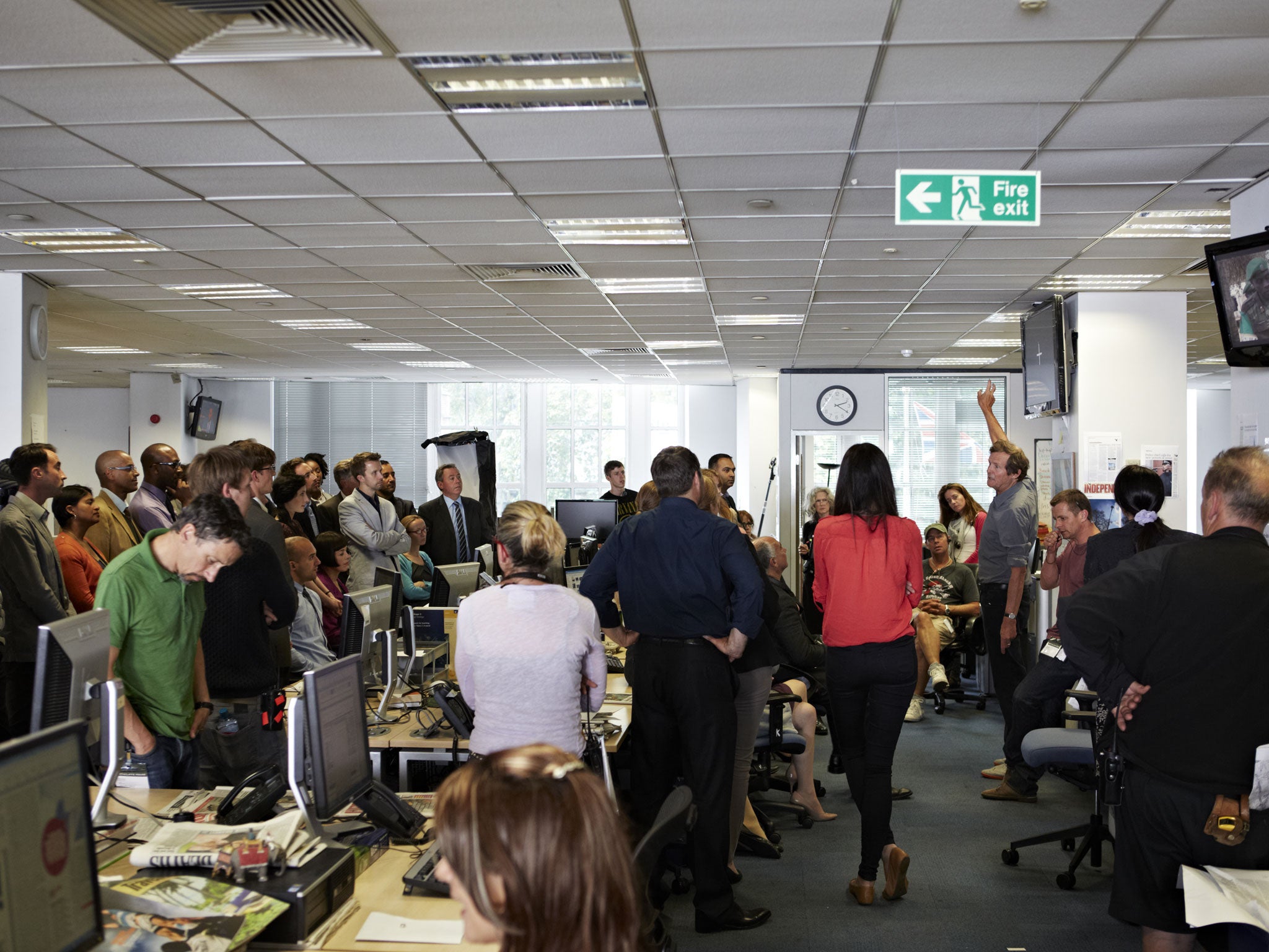 Here is the news: David Hare (arm raised) on set at the Independent offices