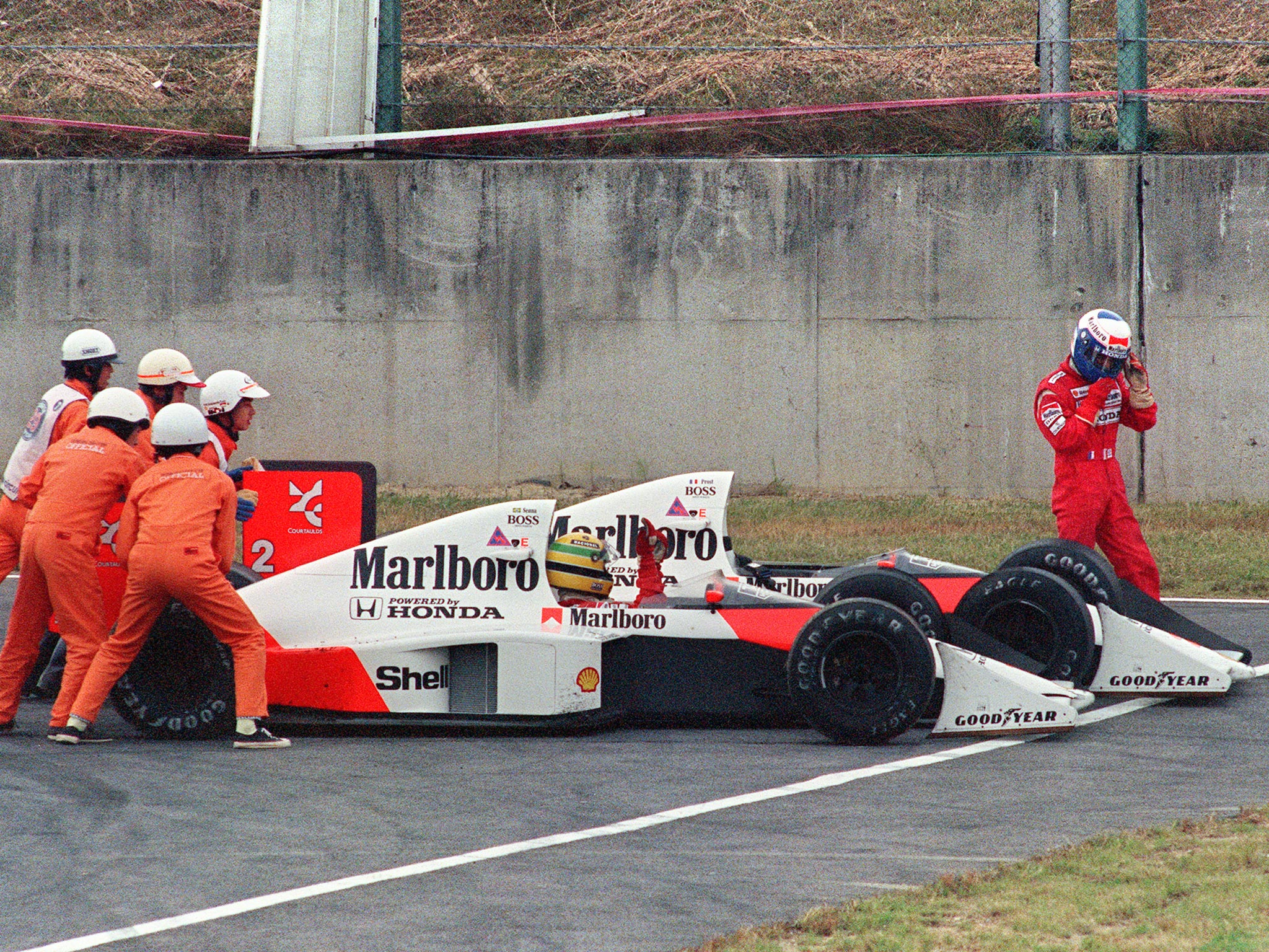 Senna and Prost collide at the 1989 Japanese Grand Prix, which later saw Senna disqualified and Prost handed the title