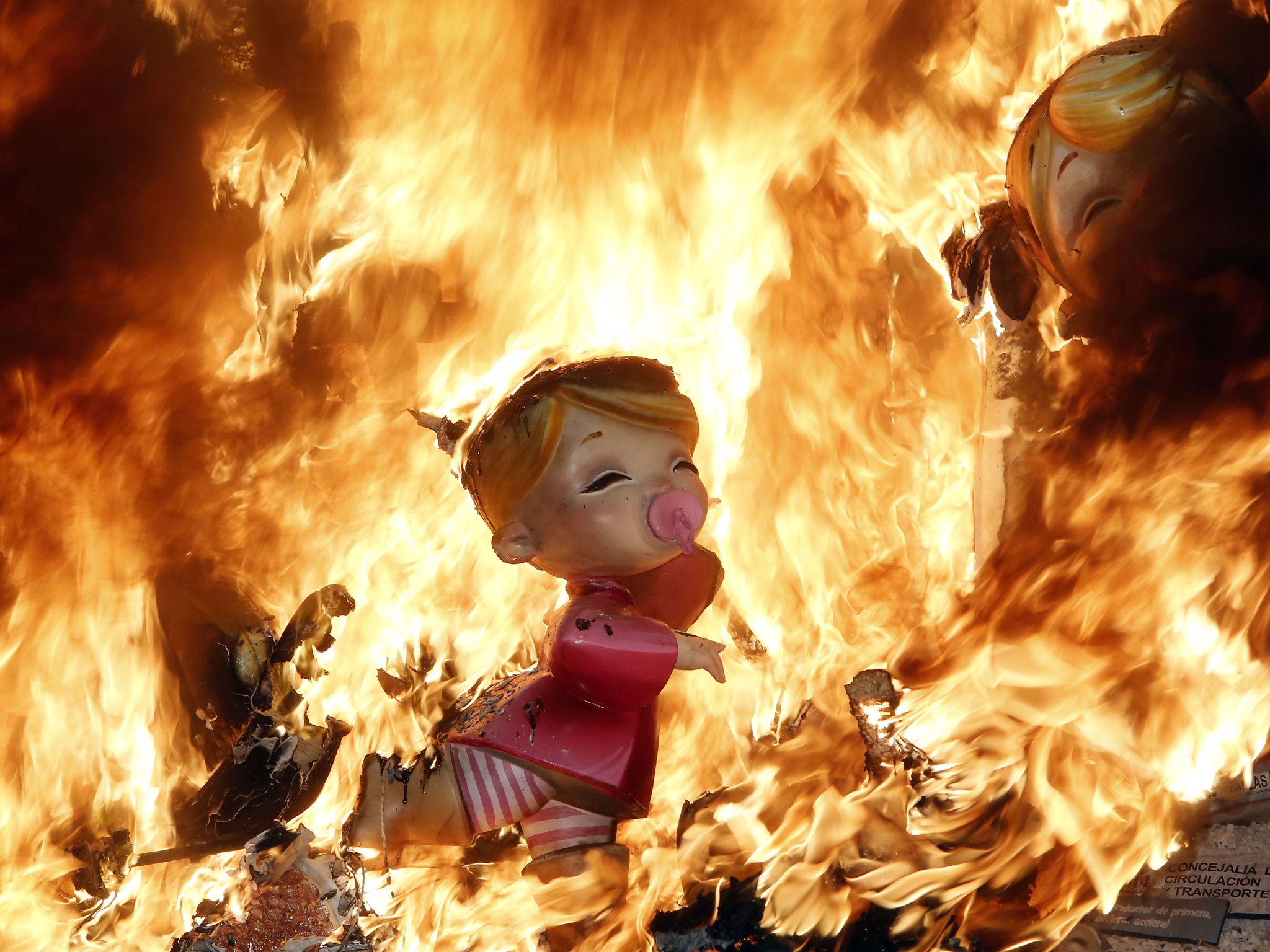 Satirical sculptures burn during the traditional Fallas festival in Valencia