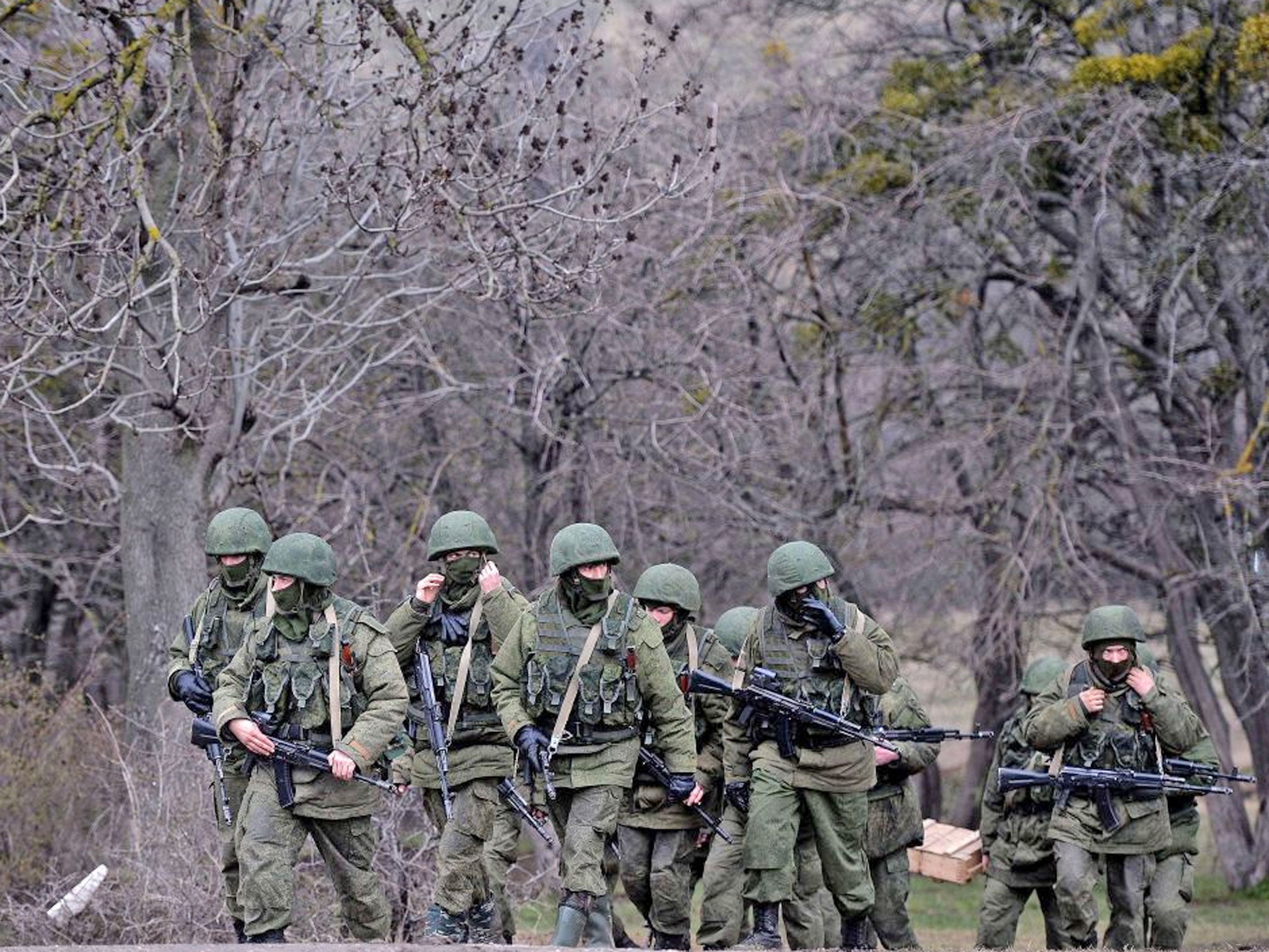 Russian soldiers patrol the area surrounding the Ukrainian military unit in Perevalnoye, outside Simferopol