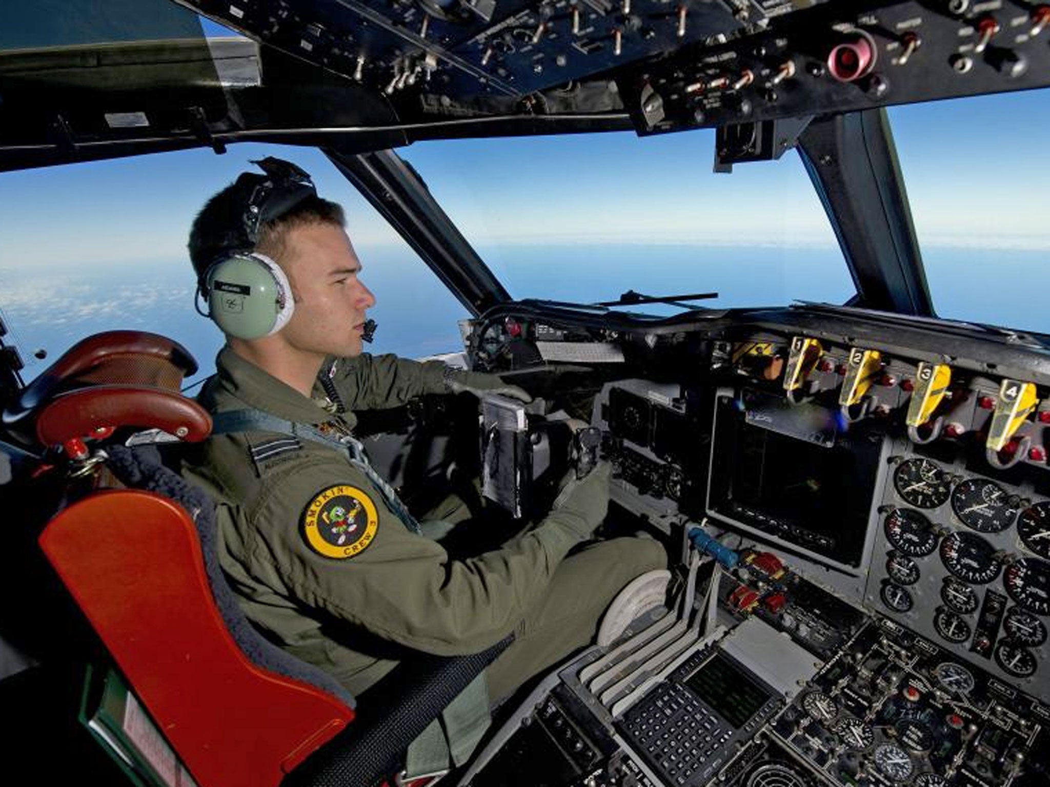 Royal Australian Air Force pilot, Flight Lieutenant Russell Adams from the tenth Squadron, steering his AP-3C Orion over the Southern Indian Ocean during the search for missing Malaysian Airlines flight MH370