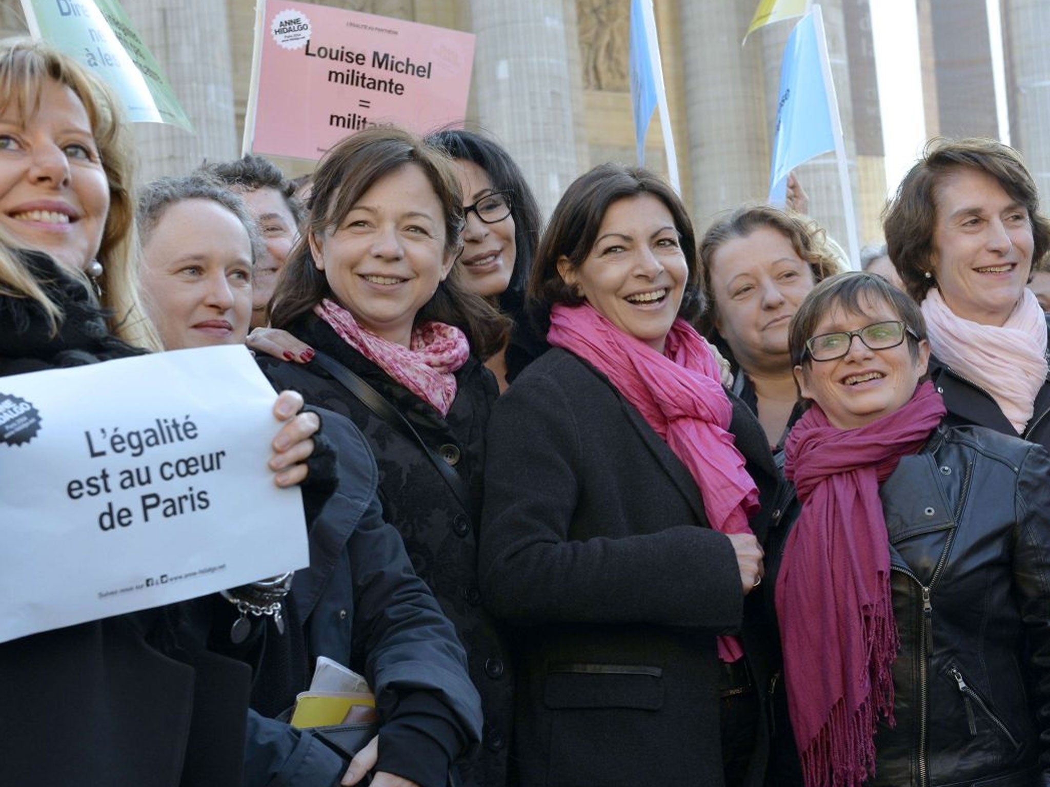 French Socialist Party (PS) candidate for the 2014 mayoral elections in Paris and Paris deputy-Mayor Anne Hidalgo (C) poses at the Pantheon in Paris with PS candidates for the municipal elections