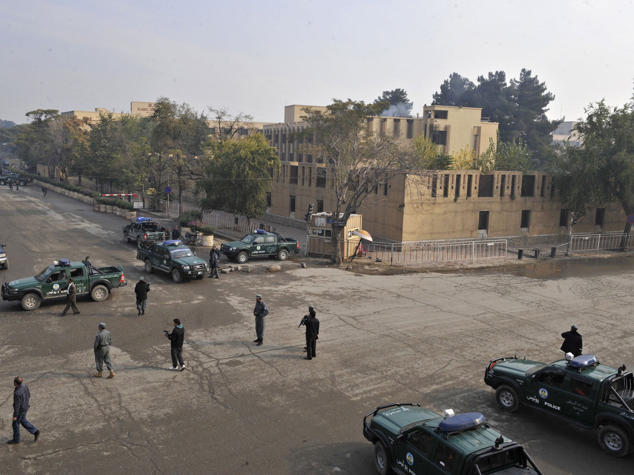 Armed Afghan police surrround the five star Serena hotel in central Kabul, in 2009.
