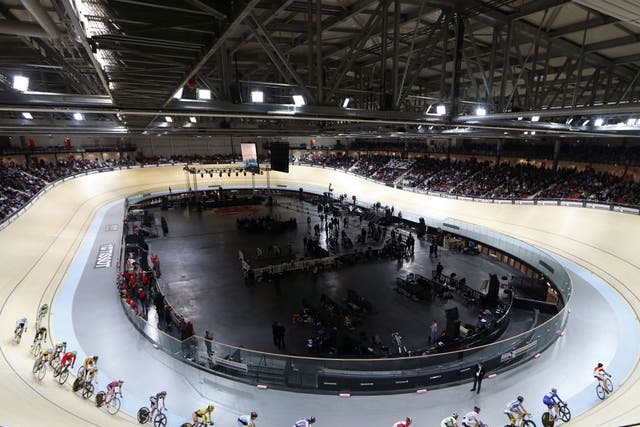 Cyclists race during the inauguration ceremony of the Saint-Quentin-en-Yvelines Velodrome in Montigny-le-Bretoneux