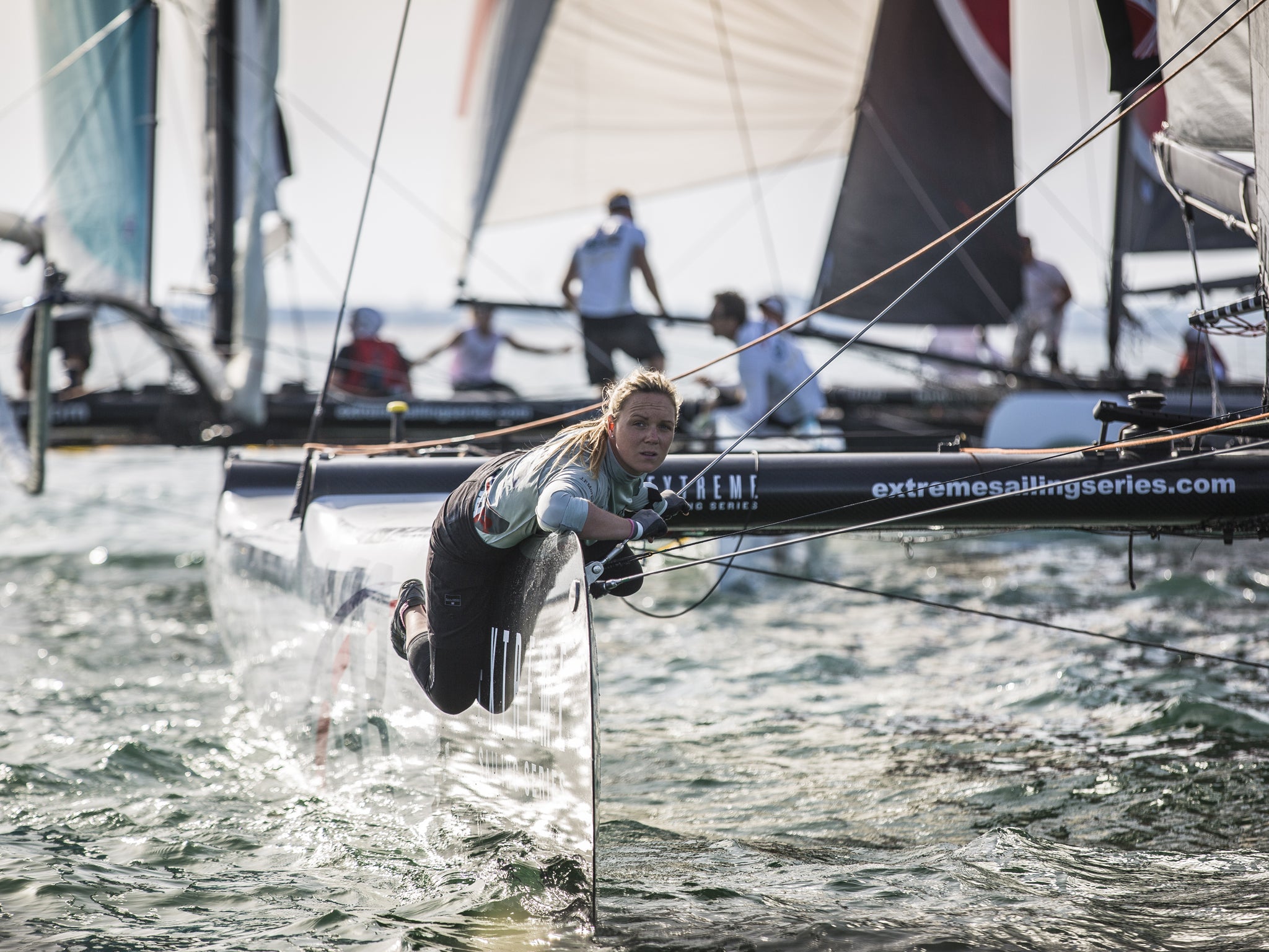 British gold medallist Pippa Wilson weighs up the race track from the bow of Sir Ben Ainslie’s J.P.Morgan/BAR Extreme 40 on the second day of the Muscat regatta