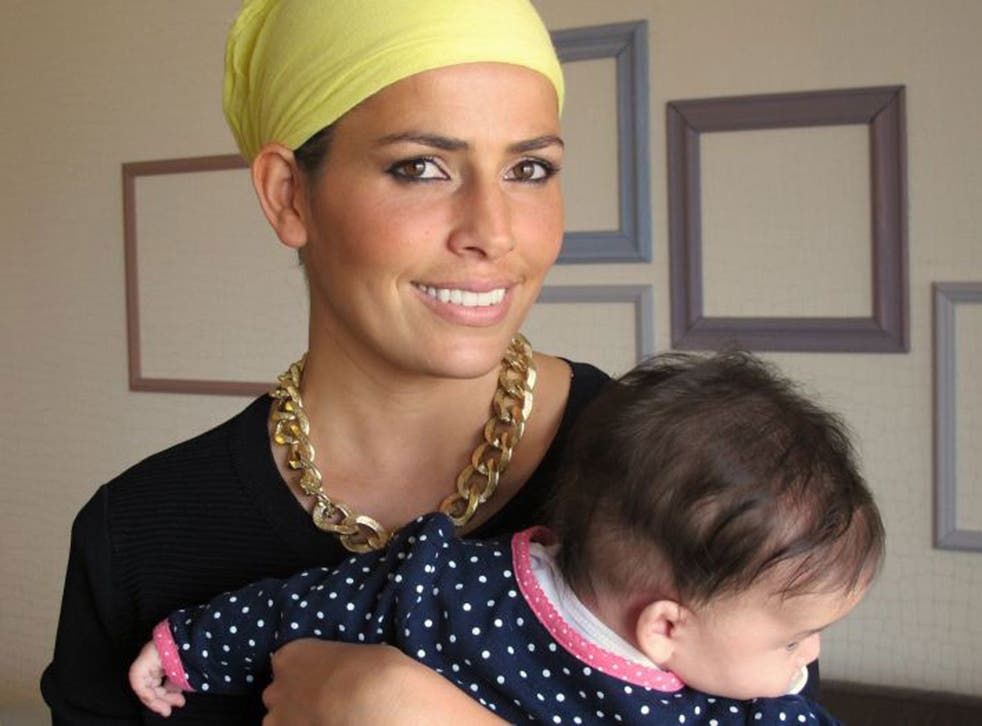 Ms Abargil with her four-month-old daughter at her home in Netanya, Israel