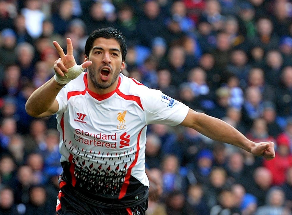 Luis Suarez celebrates his hat-trick for Liverpool against Cardiff