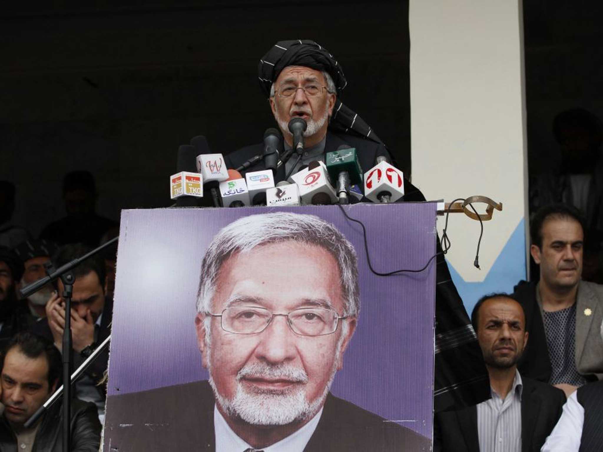 Afghan presidential candidate Zalmai Rassoul speaks during a campaign rally in Kandahar