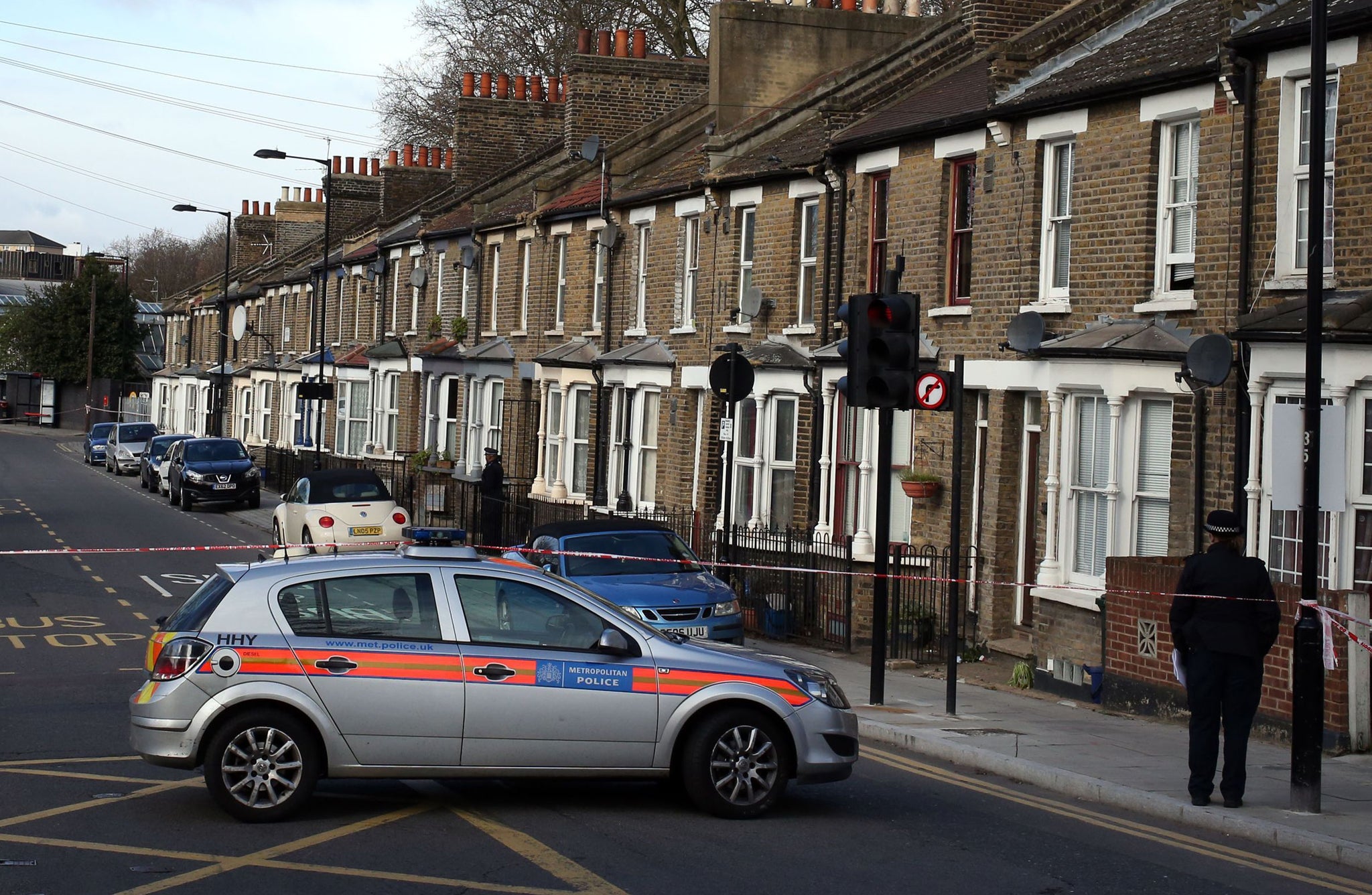 Police at the scene in Eastway, Hackney, east London, where the teen was killed