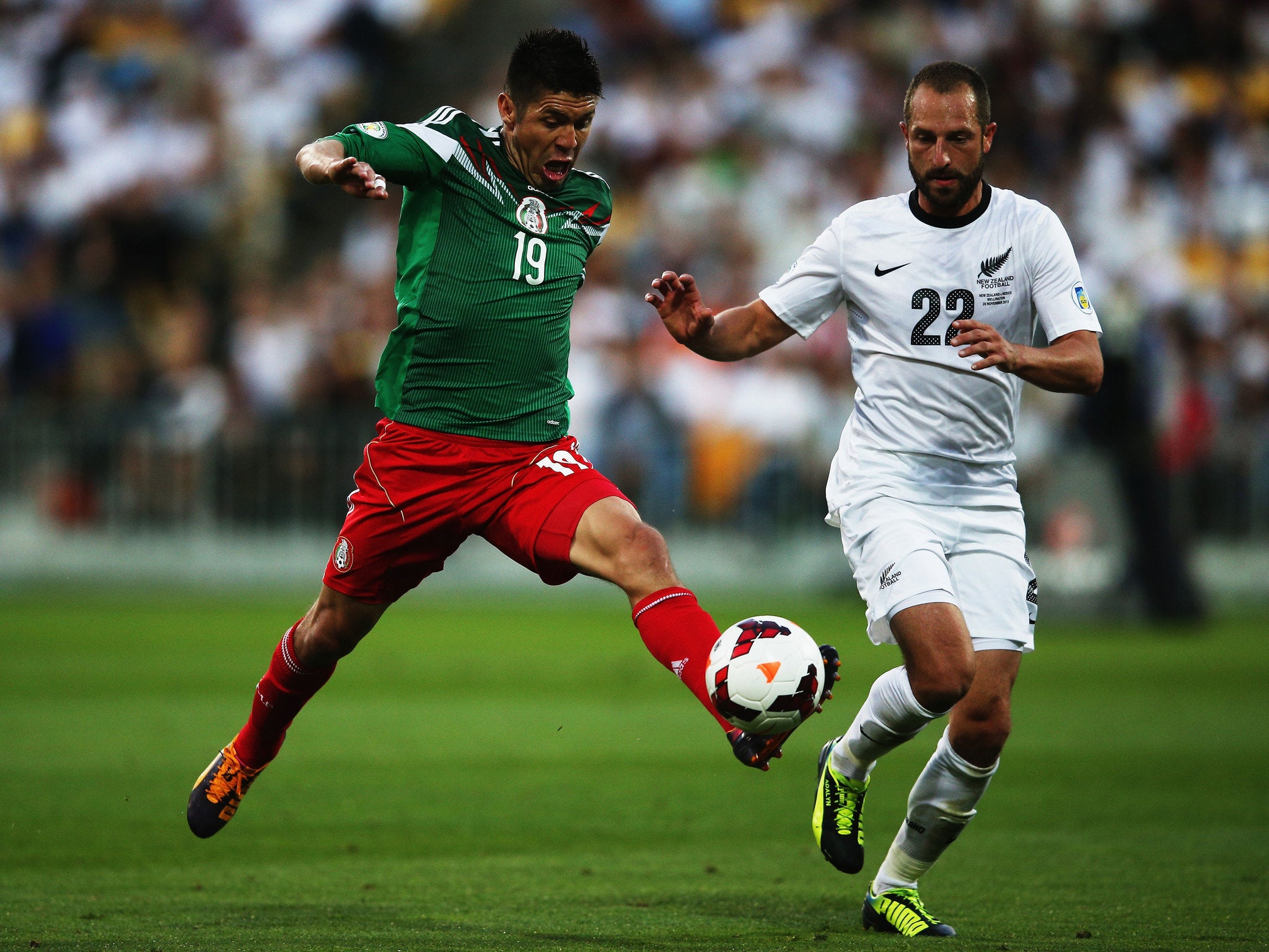 Oribe Peralta of Mexico in action against New Zealand