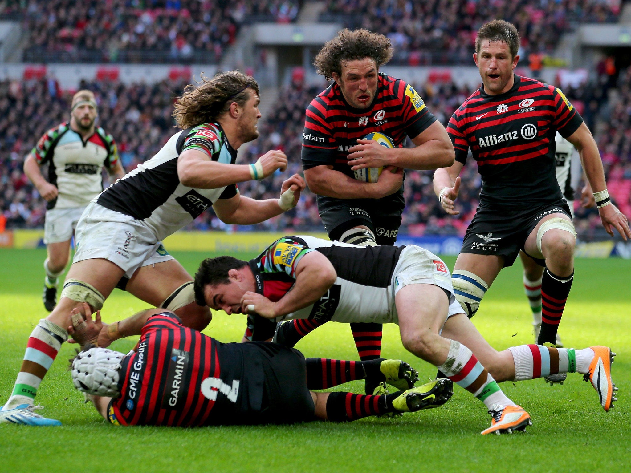 Jacques Burger of Saracens bursts through to score a try (GETTY)