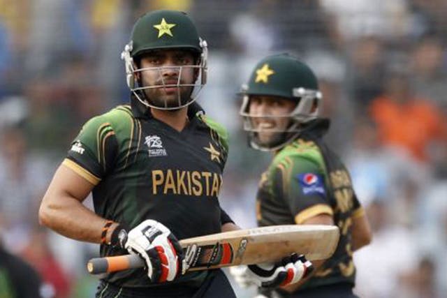 Umar Akmal (left) and Kamran Akmal on the charge in Pakistan’s 16-run victory over Australia