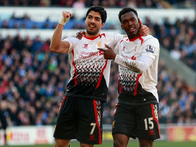Among the title-chasing scorers were Liverpool’s Luis Suarez, left, and Daniel Sturridge, right