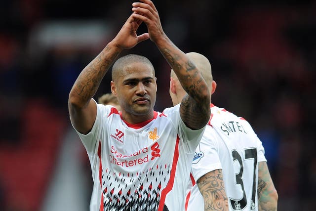 Glen Johnson applauds the travelling Liverpool fans following the 6-3 victory over Cardiff